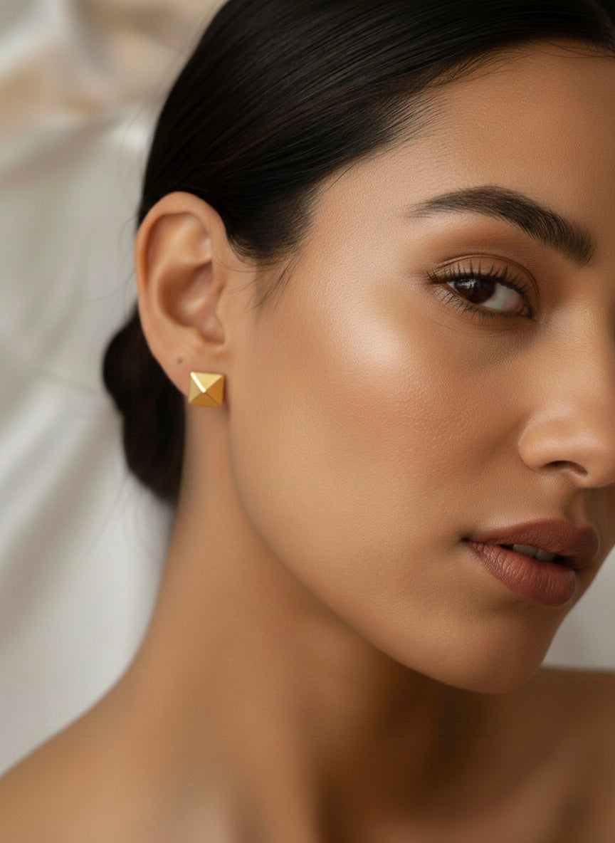 Three pairs different golden stud earrings