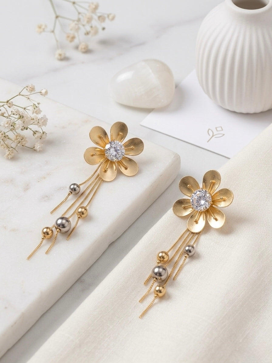 Elegant gold floral drop statement earrings.