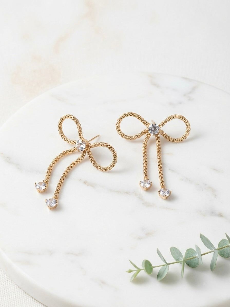 Charming gold bow drop crystal earrings.