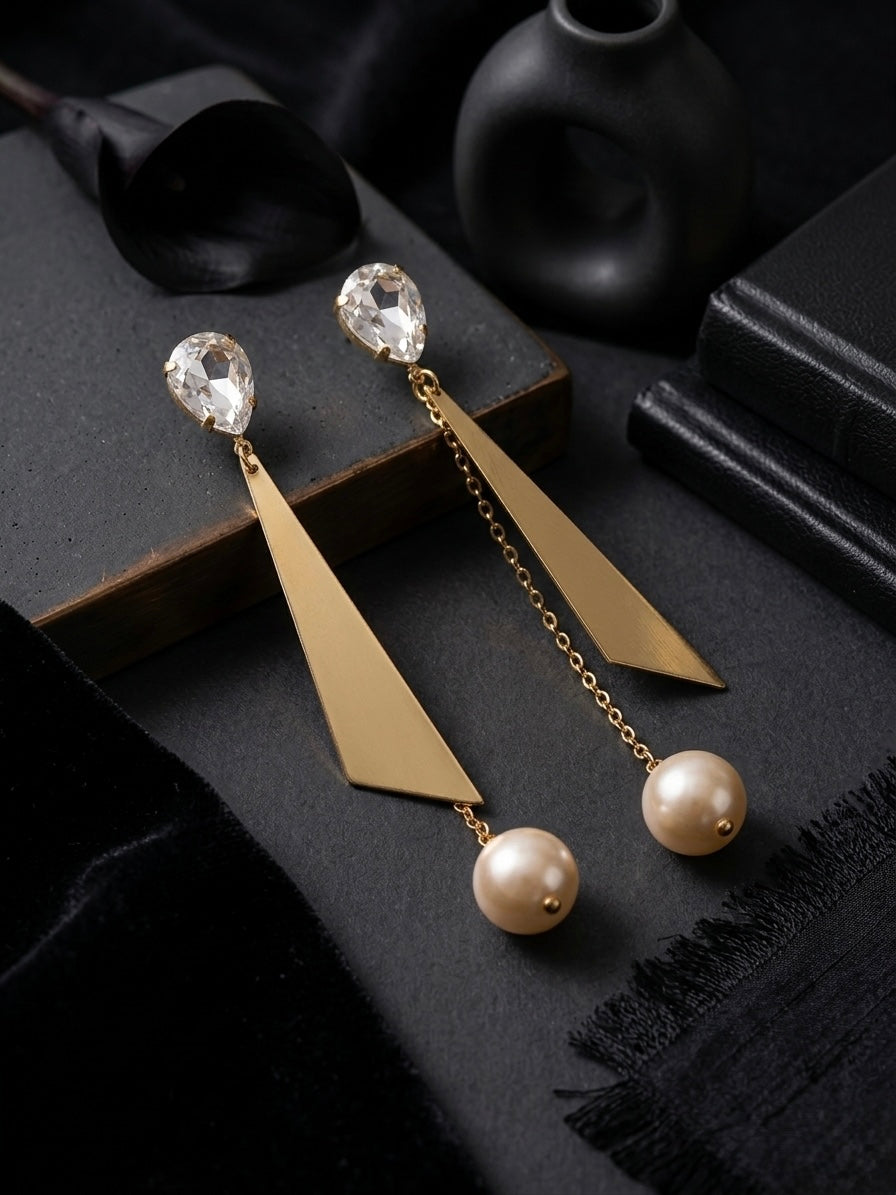Contemporary gold geometric crystal pearl earrings.
