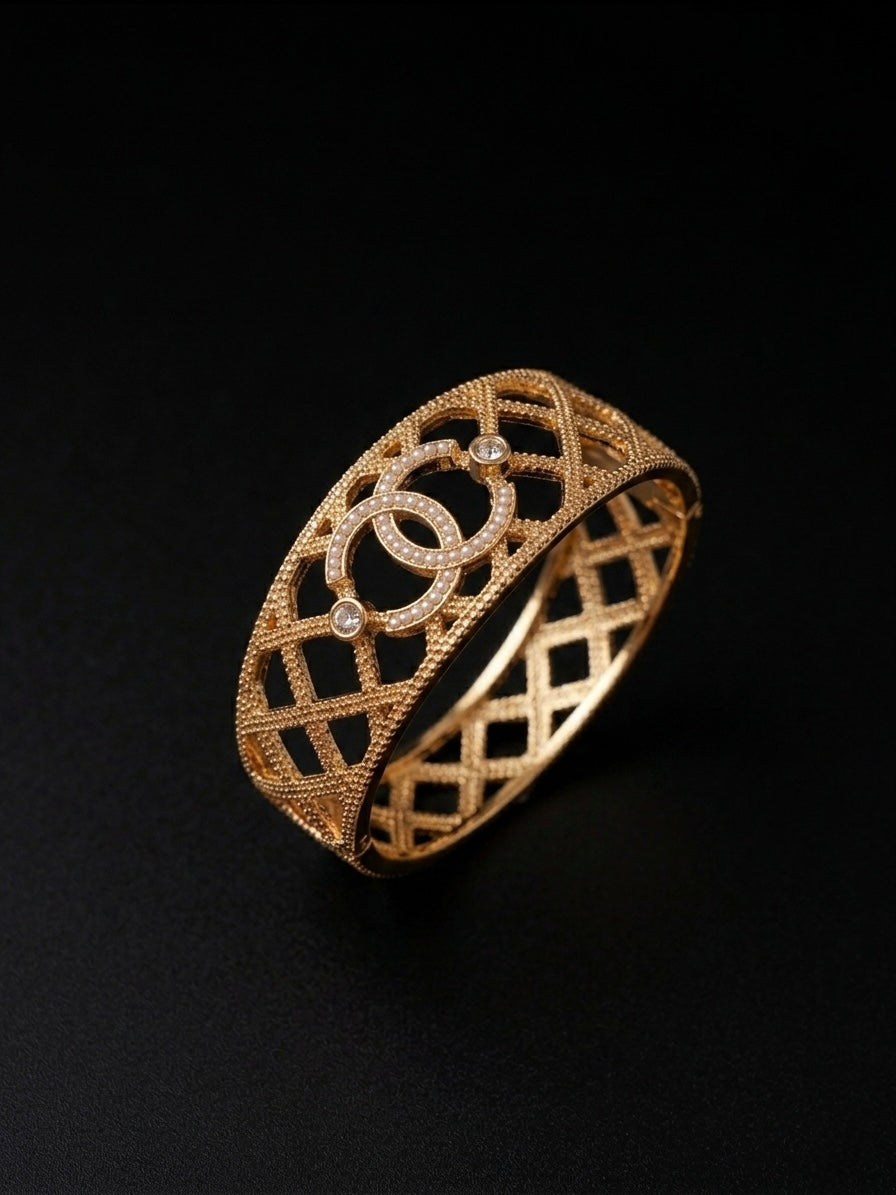 Luxurious cutout gold textured statement bracelet.