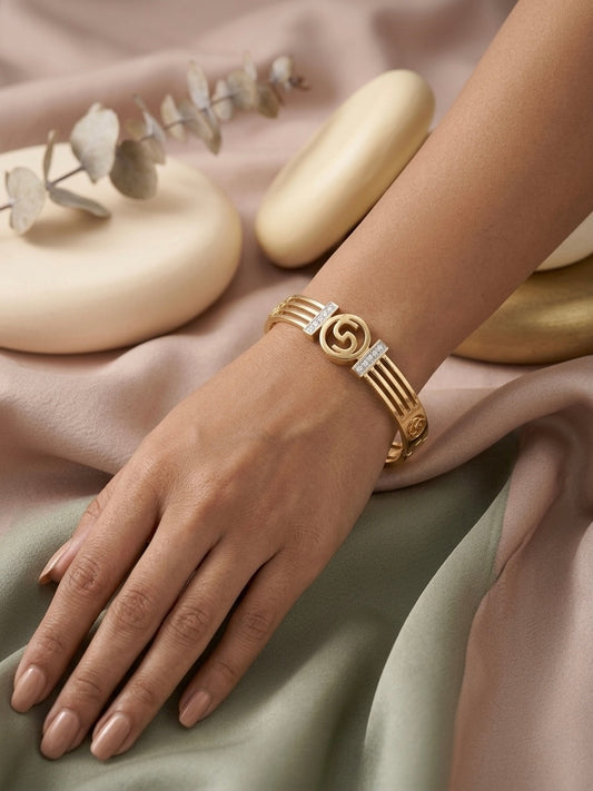 Modern split-band gold crystal statement bangle