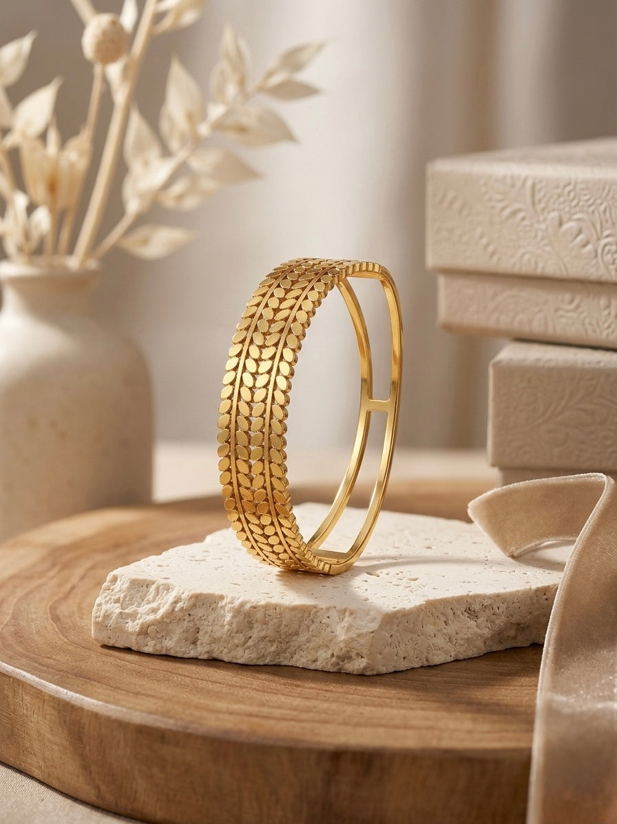 Sophisticated textured gold botanical cuff bracelet.