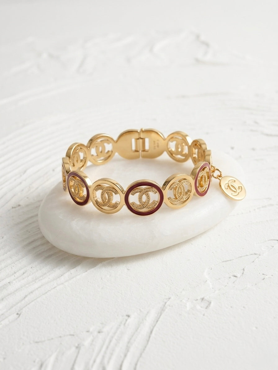 Luxury gold logo link charm bracelet.