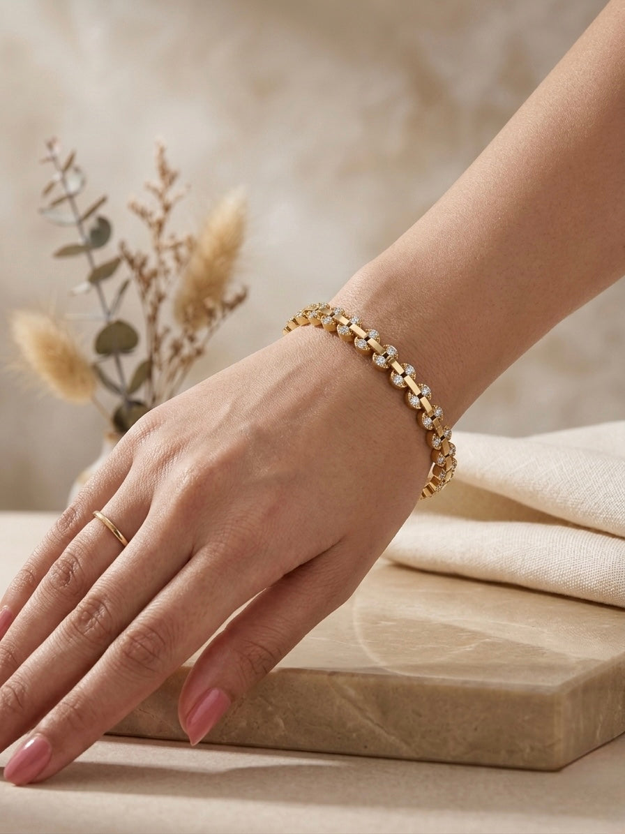 Gold watch-link crystal tennis bangle.