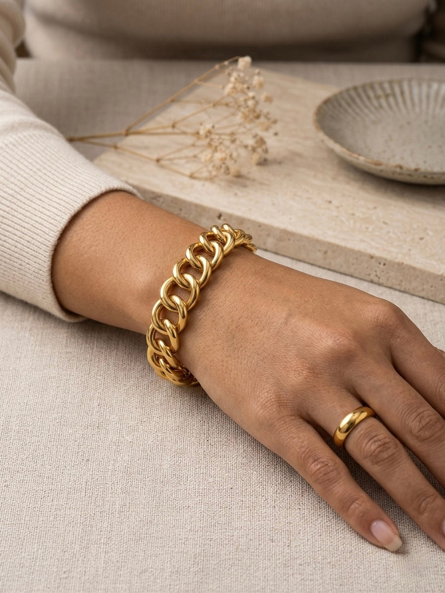 Classic polished gold dome band bracelet .