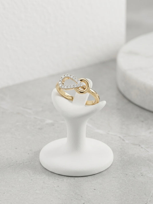 Elegant twisted infinity gold ring.