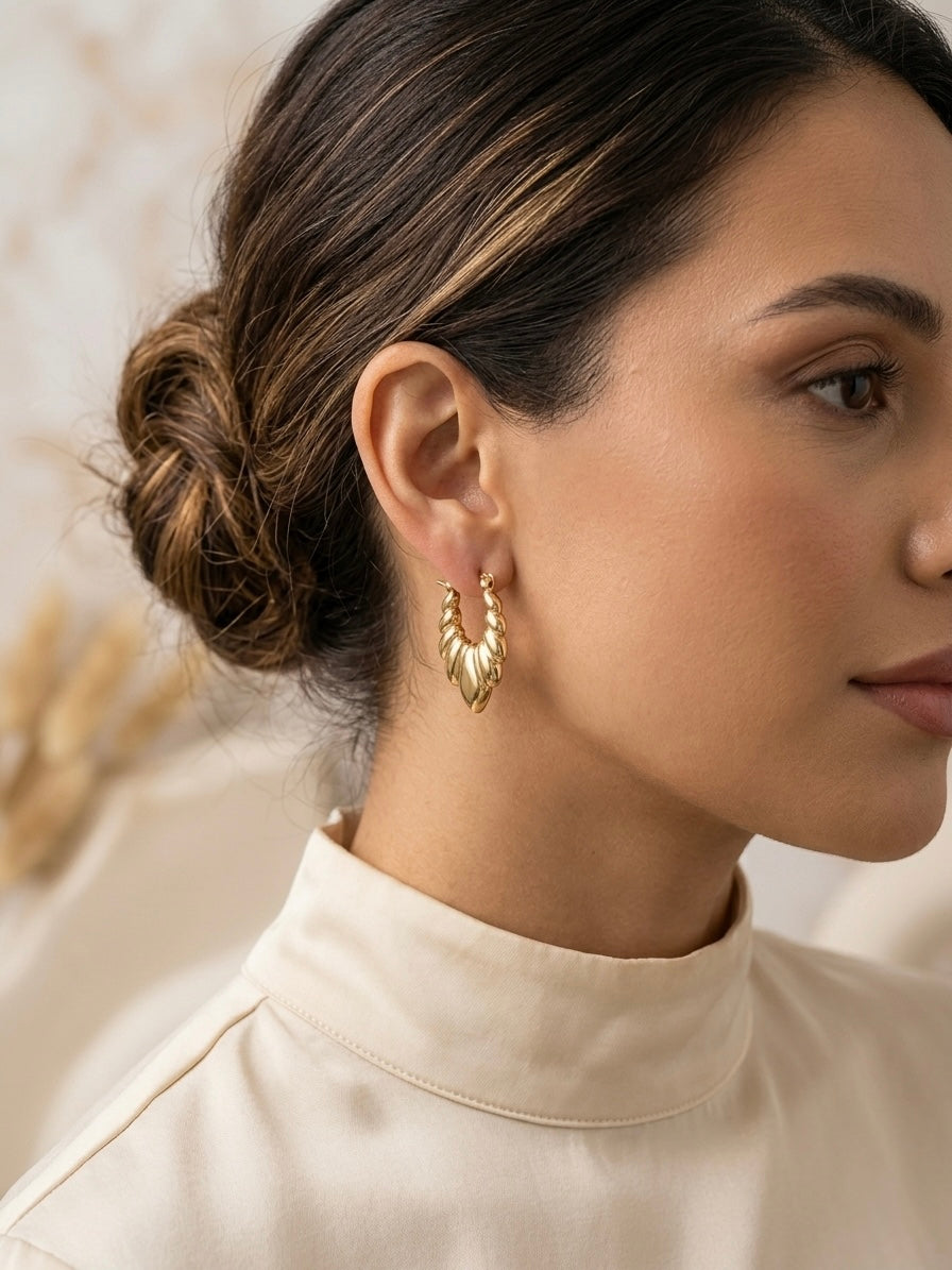 Vintage-inspired textured gold statement earrings.