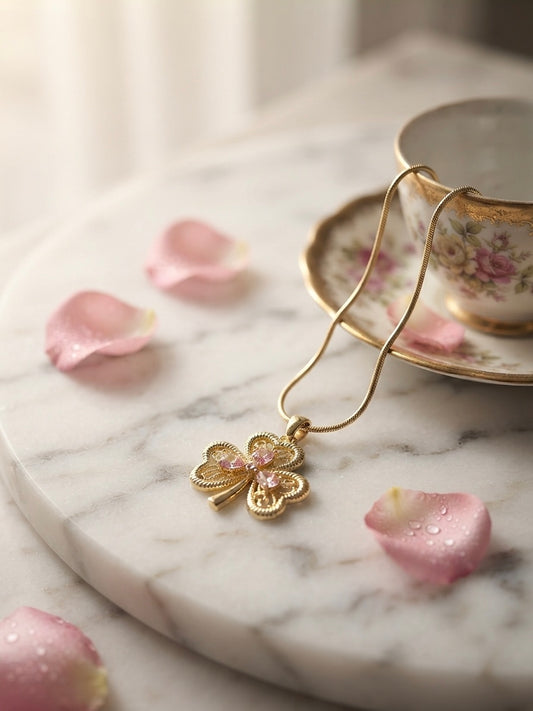 Elegant gold clover charm necklace.