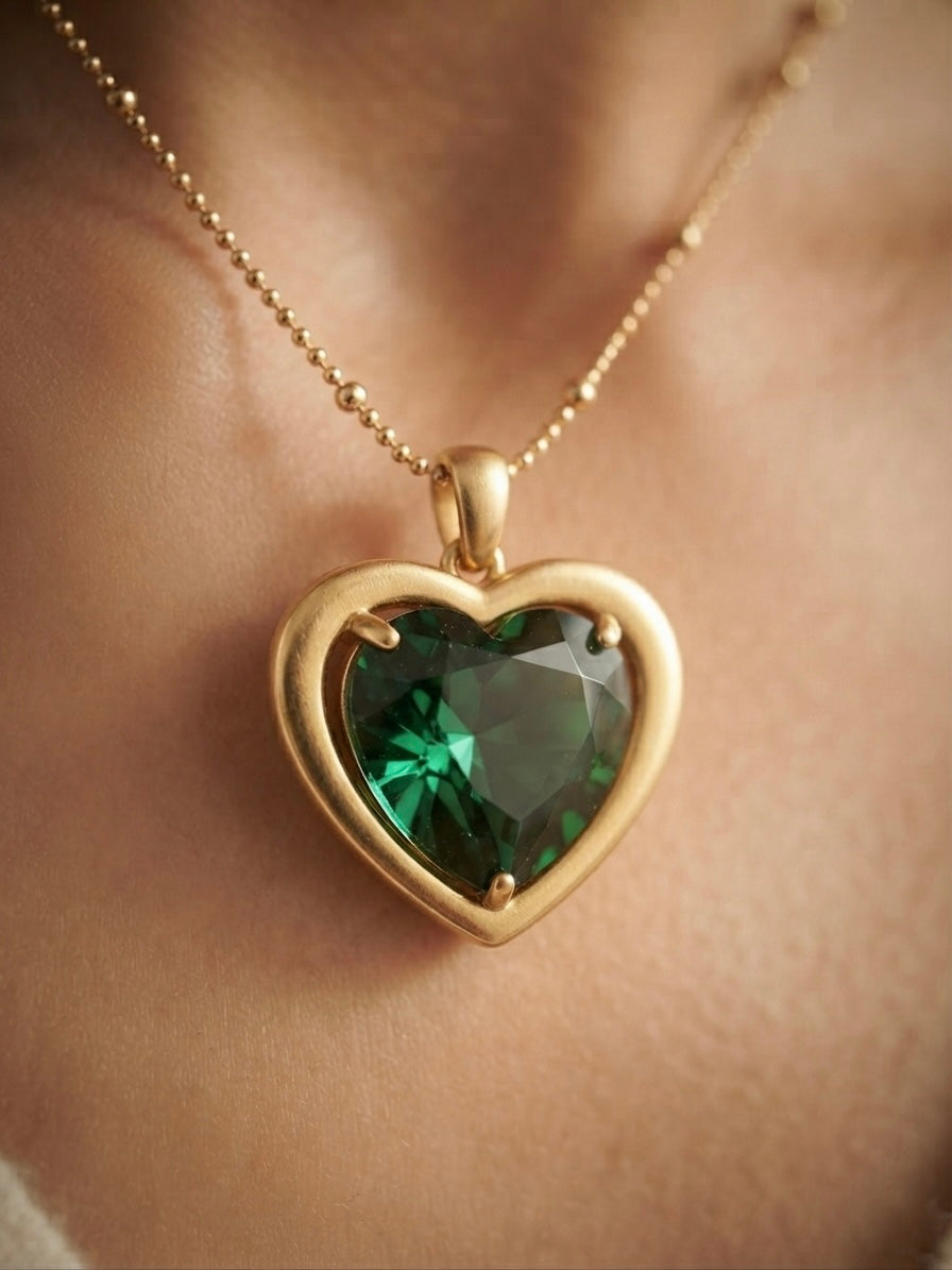 Stunning green heart, radiant gold necklace.