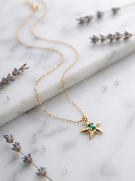Shimmering green stone, durable gold starfish.