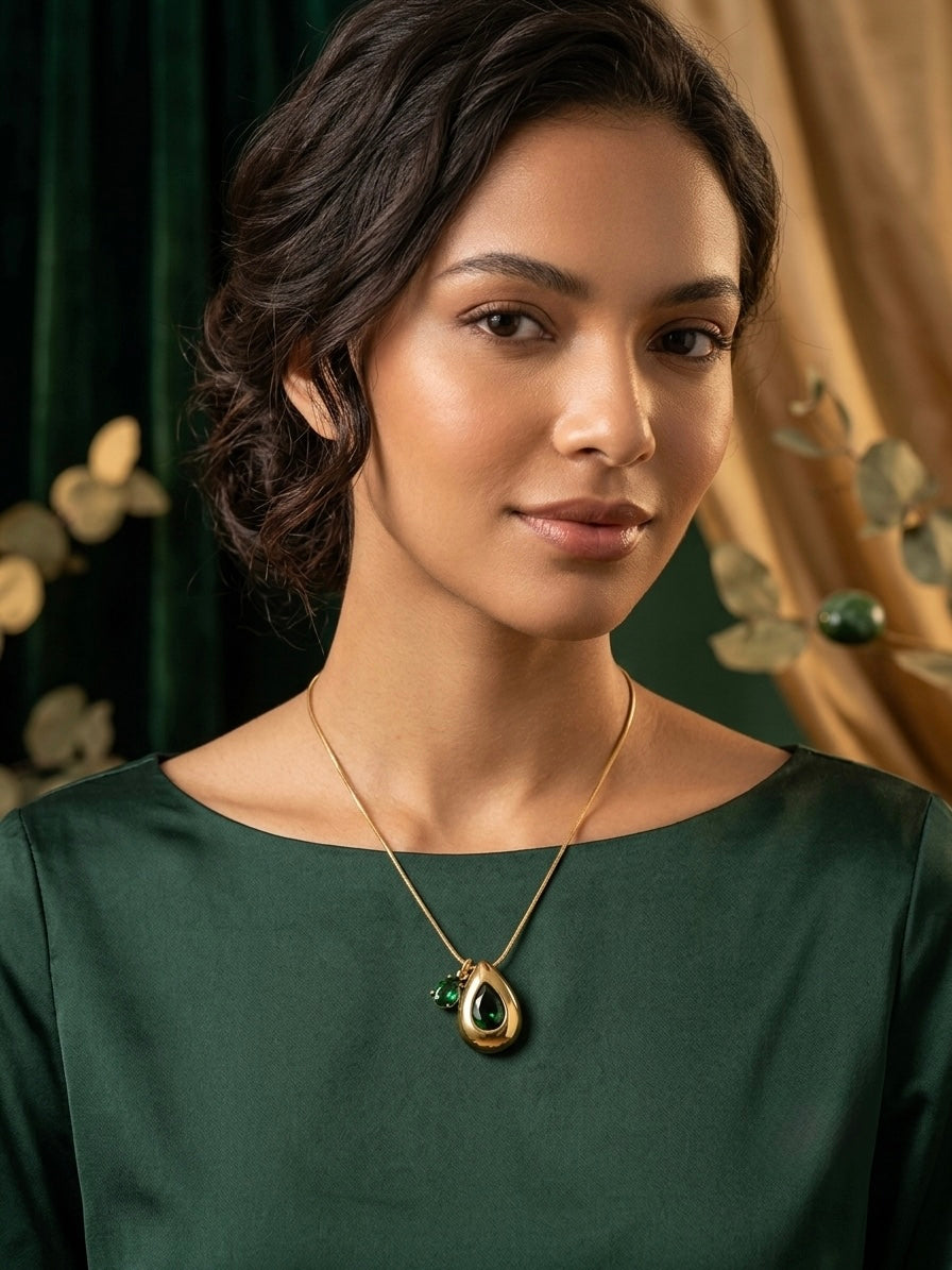 Elegant teardrop necklace, radiant gold finish.