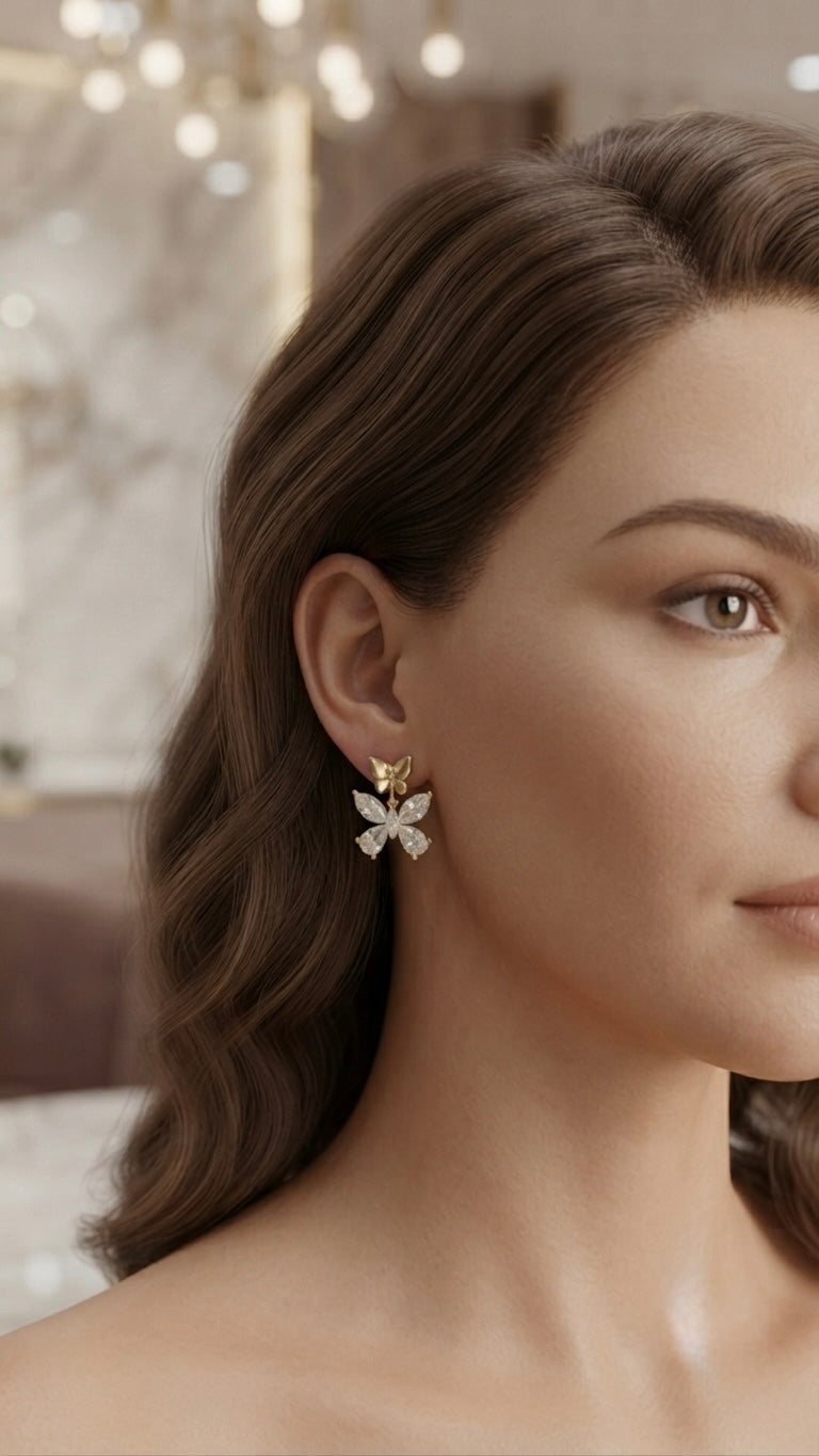 Dainty gold butterfly crystal stud earrings.