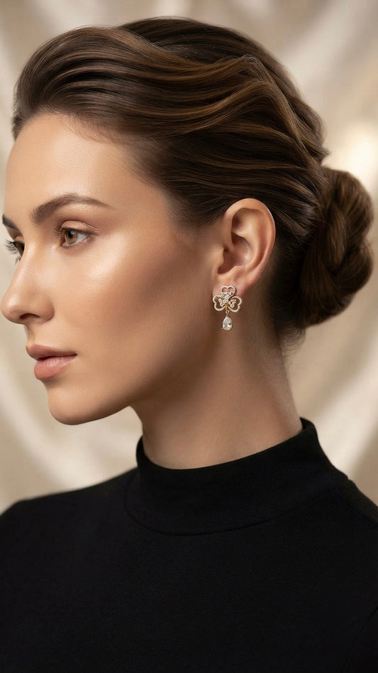 Elegant clover-inspired anti-tarnish gold earrings.