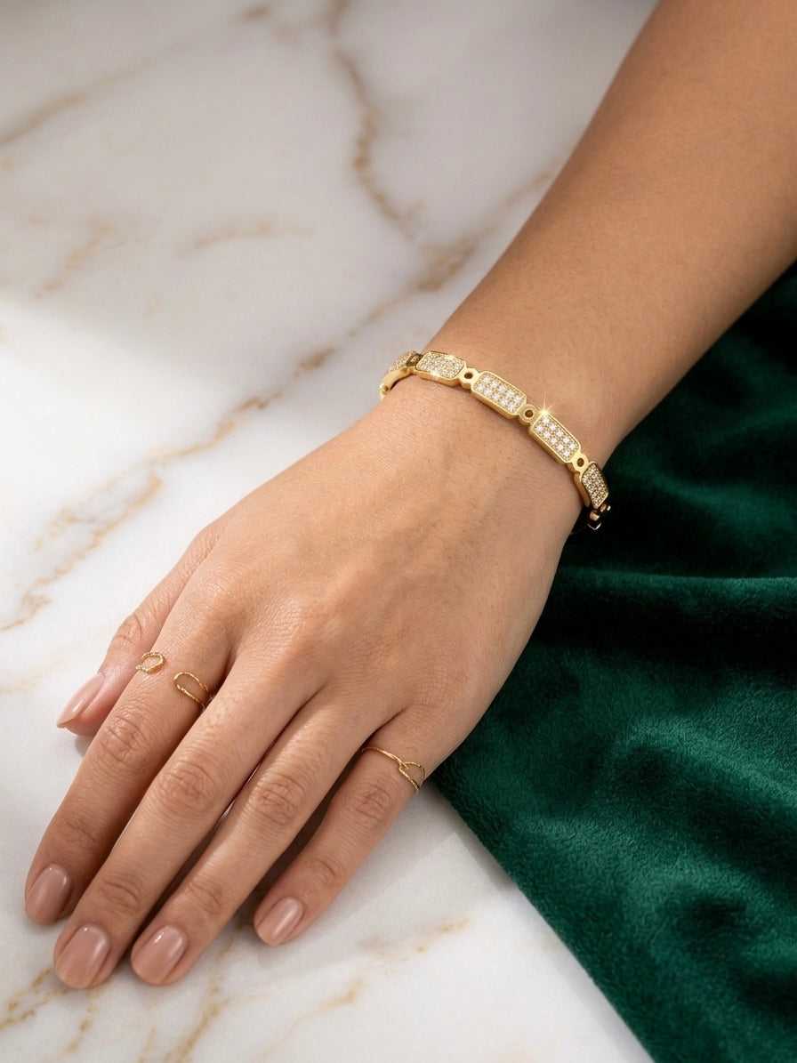 Elegant gold-plated diamond kada bracelet.