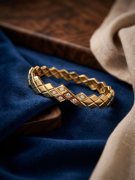 Diamond-accented geometric gold kada bracelet.