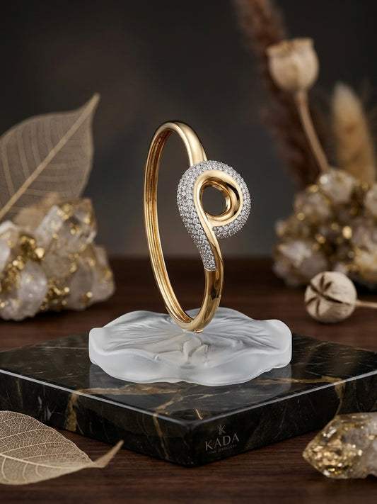 Sparkling twisted swirl gold bracelet.