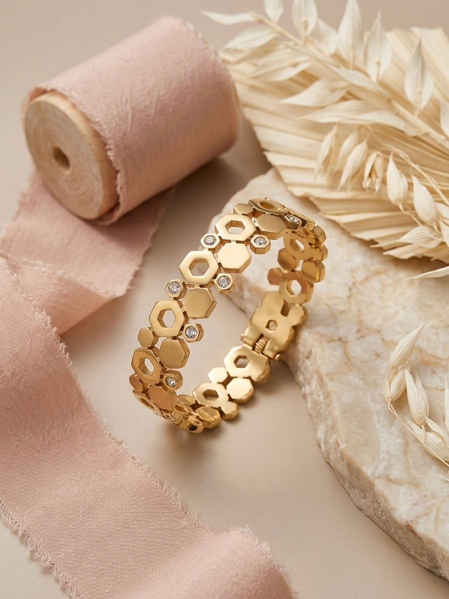 Geometric hexagonal gold statement bracelet.