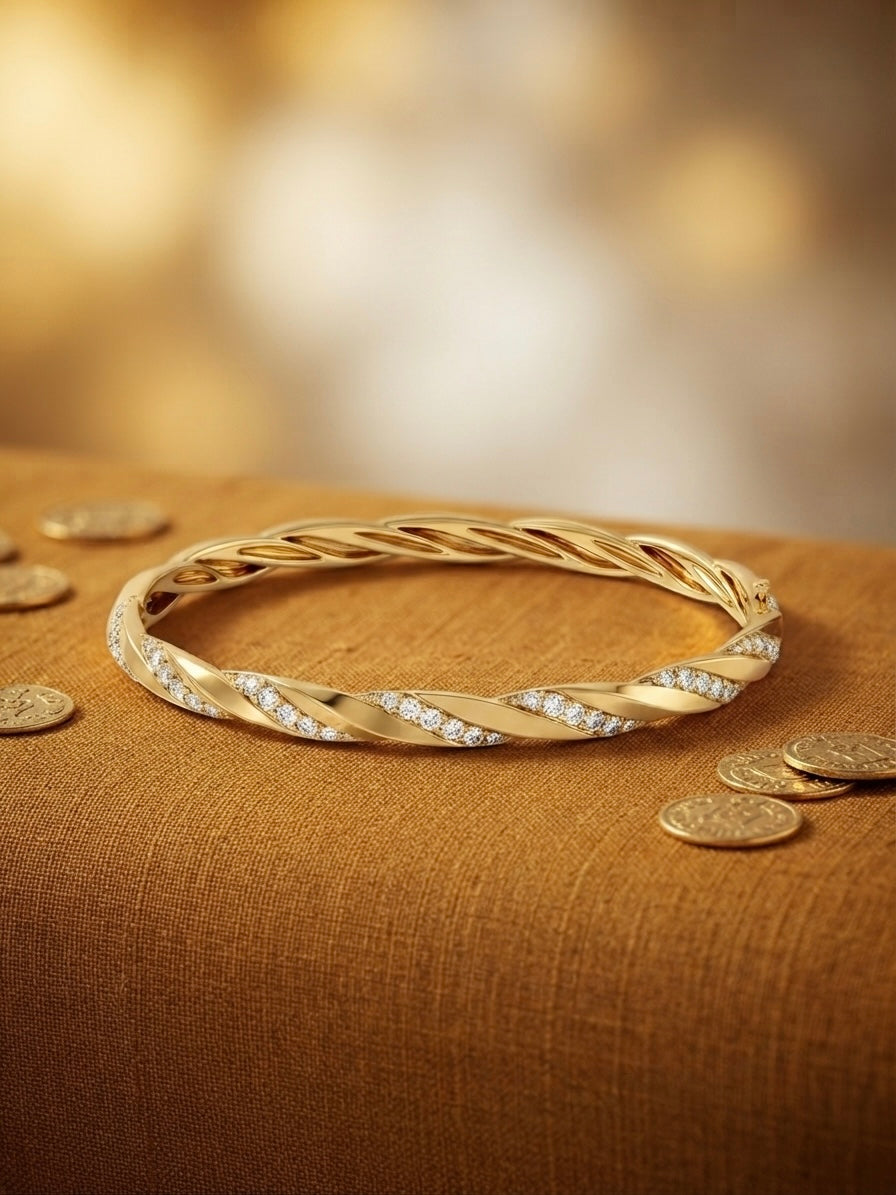 Elegant twisted diamond gold Kada bracelet.
