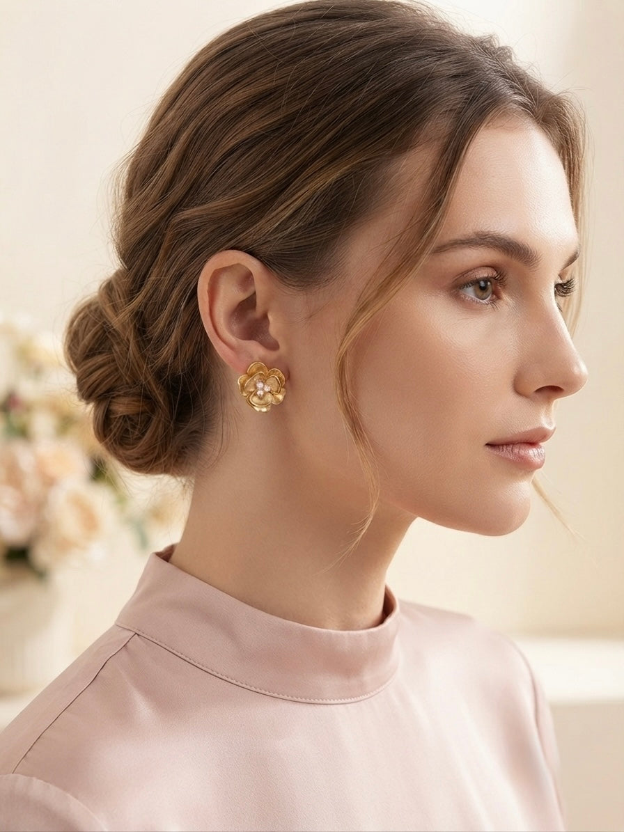 Sculpted blossom gold and pearl earrings.