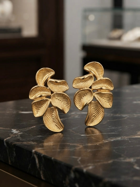 Sculpted botanical leaf statement studs.