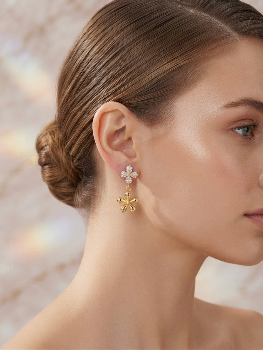Crystal flower and gold charm earrings.