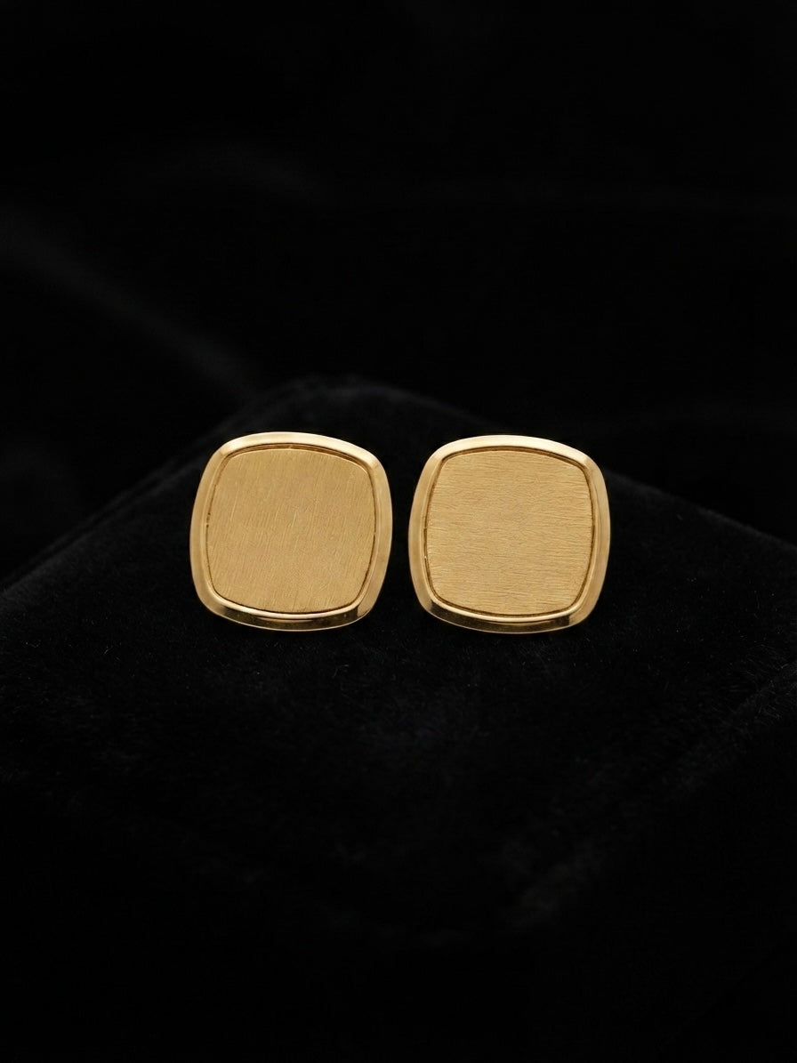 Modern minimalist brushed square studs.