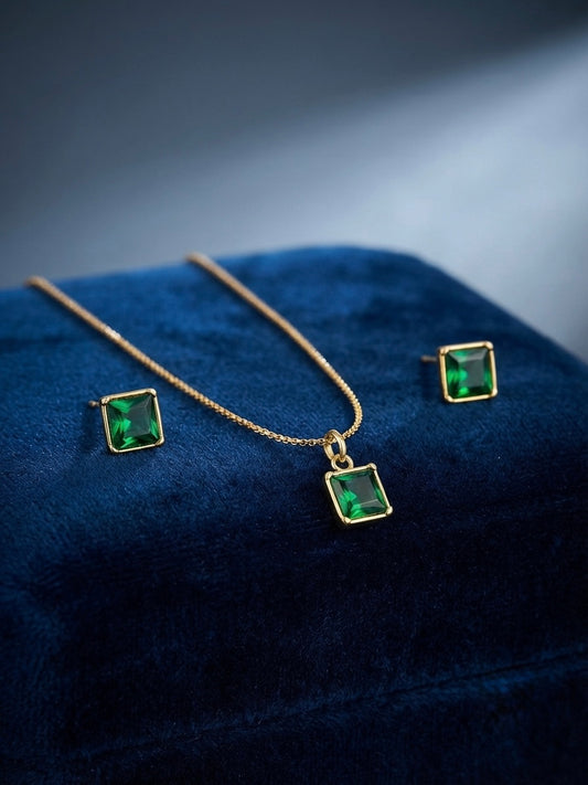 Gold emerald cut green stone necklace set.