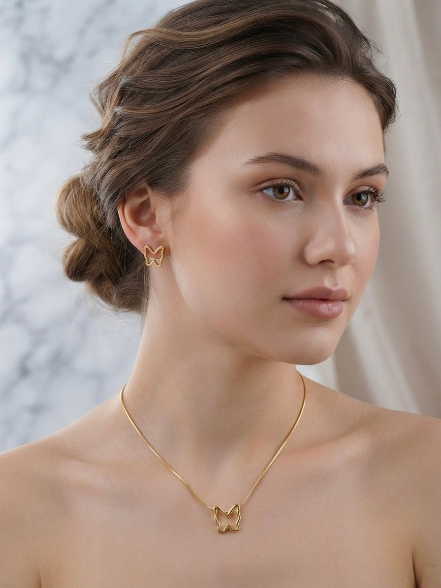 Minimalist hollow butterfly pendant and earring set.