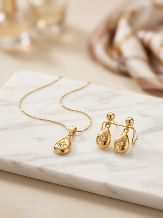 Celestial gold teardrop pendant and earring set.