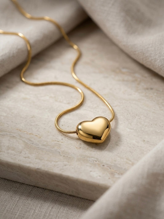Polished gold puffy heart pendant chain necklace.
