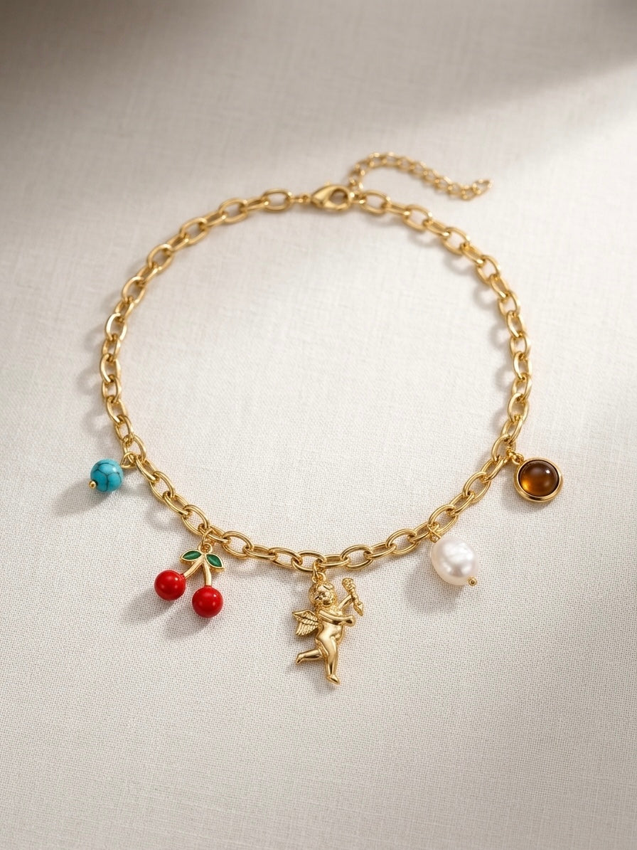 Whimsical multi-charm gold chain necklace.