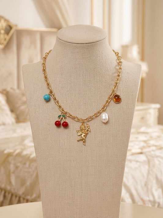 Whimsical multi-charm gold chain necklace.