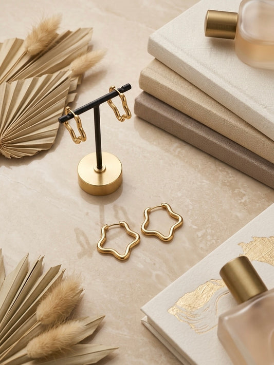 Gold open star hoop earring collection.