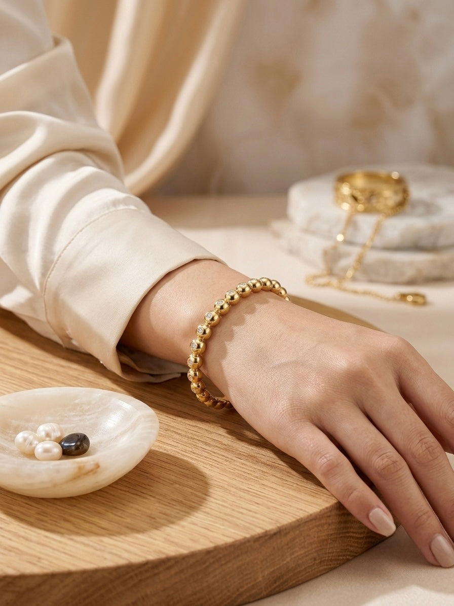 Chic gold ball studded stone bracelet.