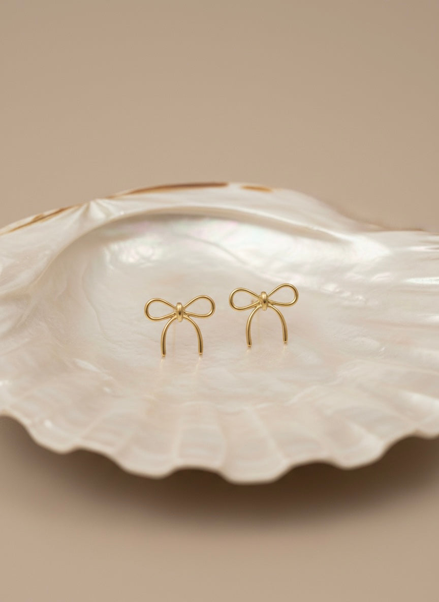 Elegant textured gold bow earrings