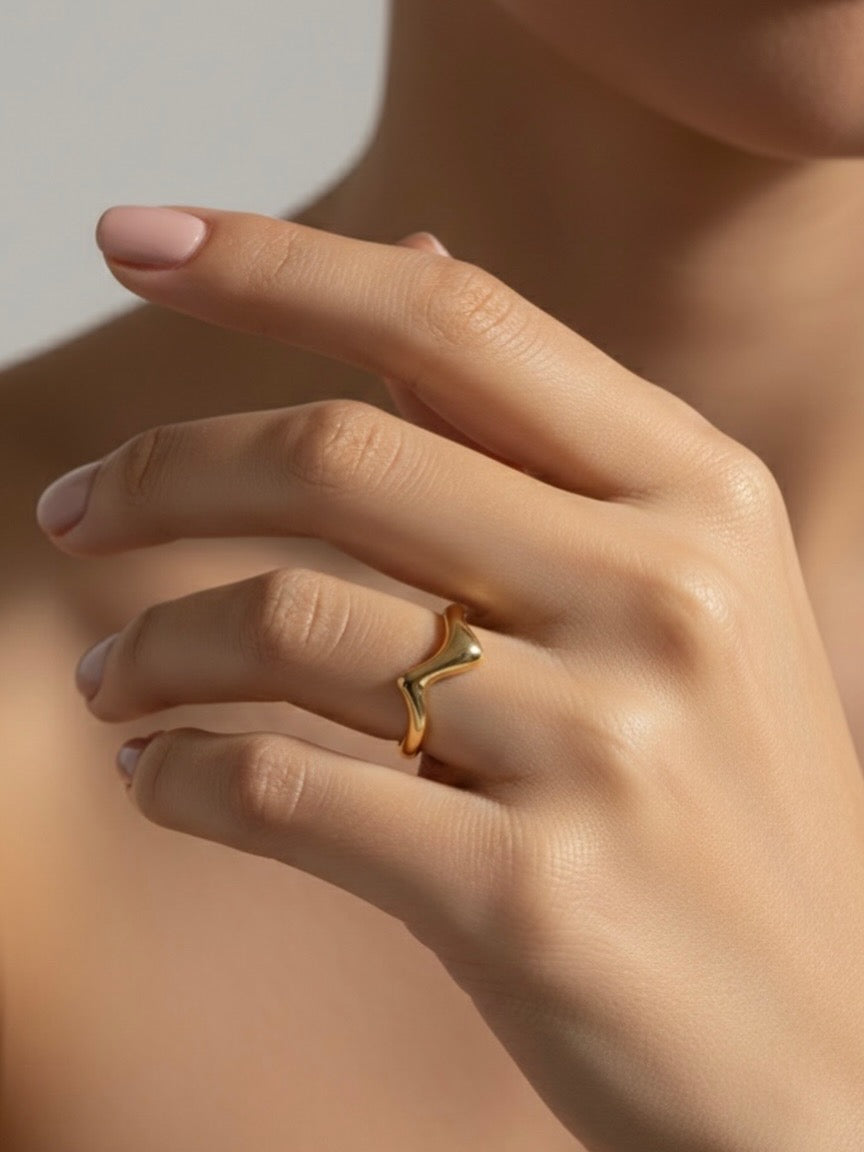 Minimal gold wave statement ring