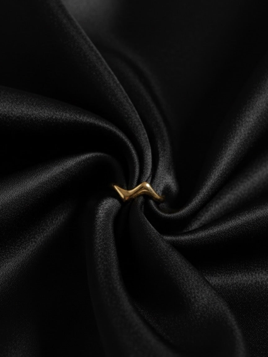 Minimal gold wave statement ring