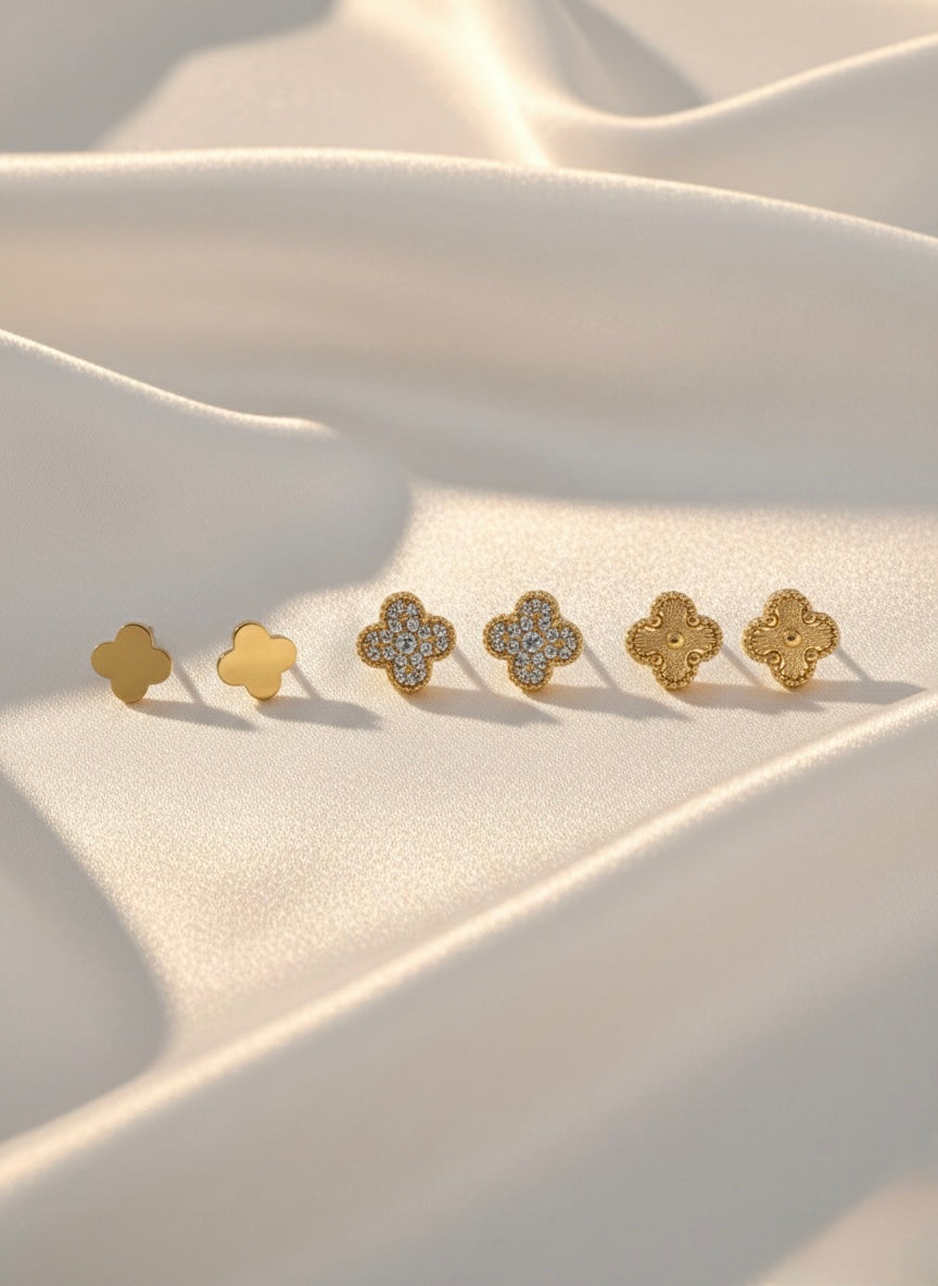 Three pairs golden studs