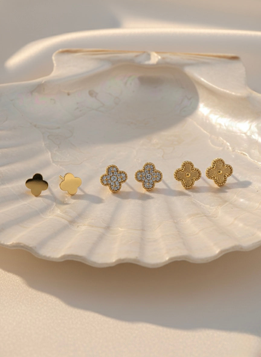 Three pairs golden studs