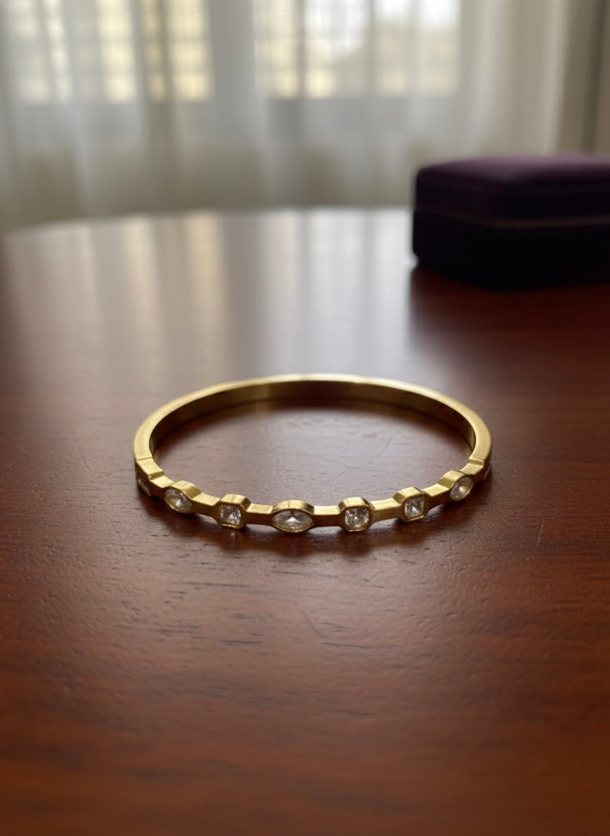 Minimal gold bangle, subtle sparkle