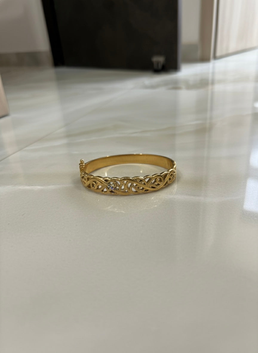 Luxury gold bangle with detailing