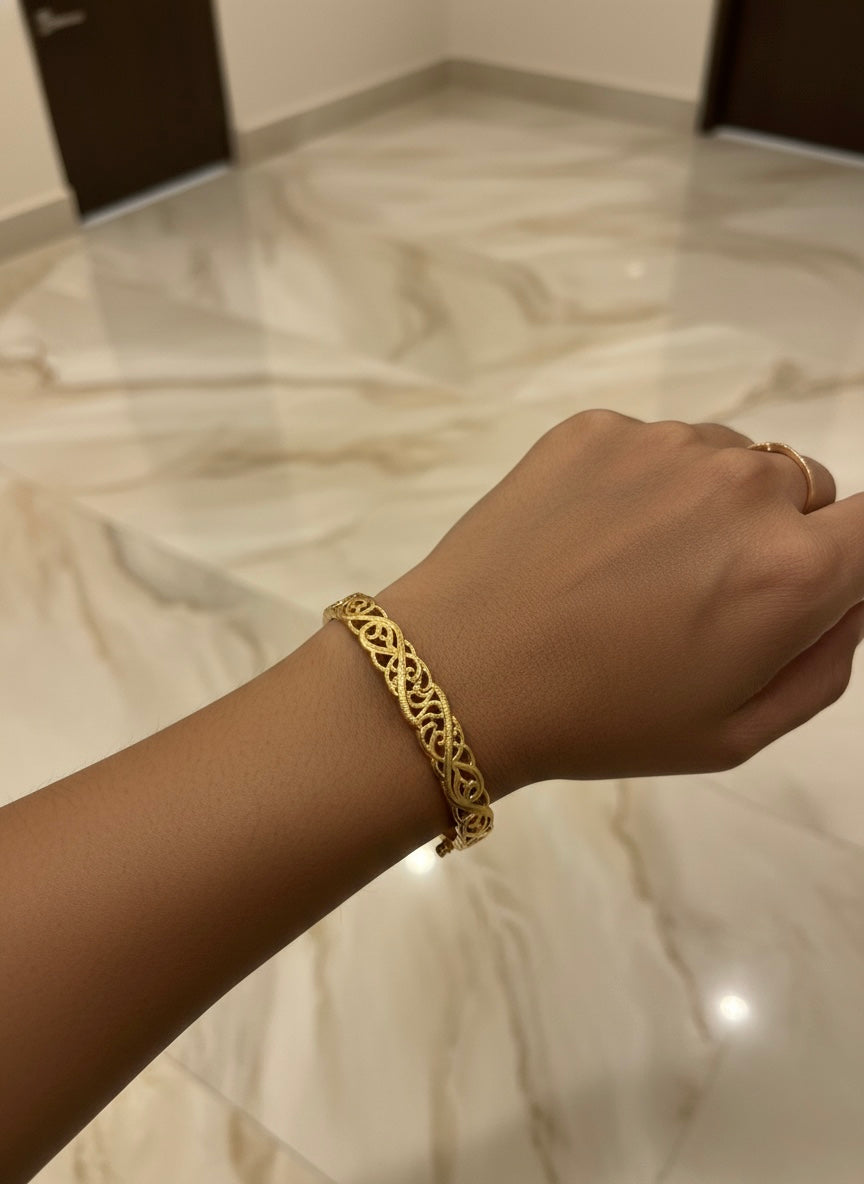 Luxury gold bangle with detailing