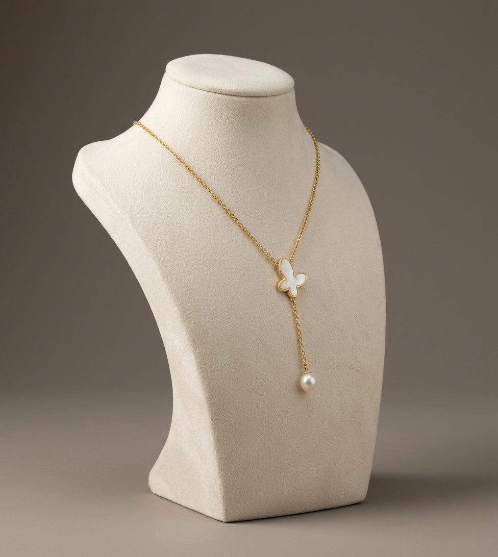 Elegant butterfly pendant with pearl drop