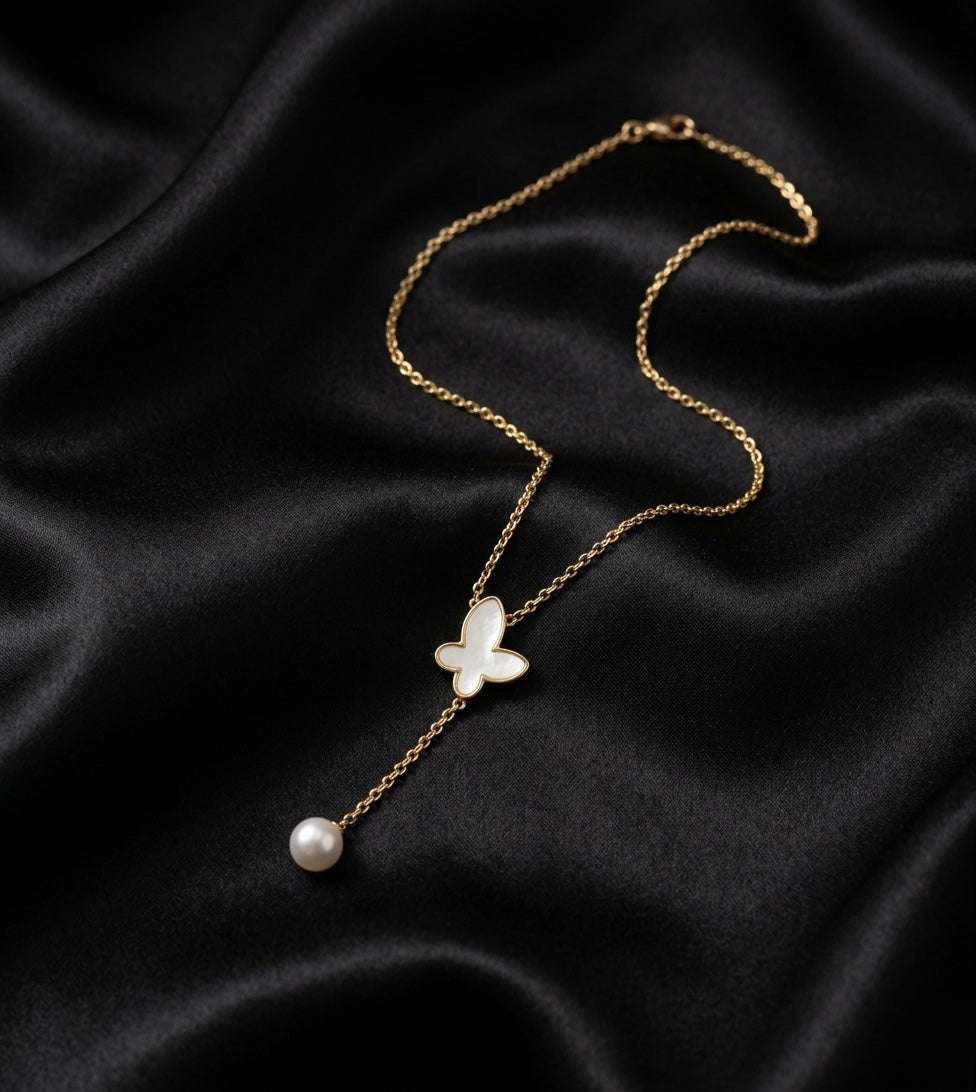 Elegant butterfly pendant with pearl drop