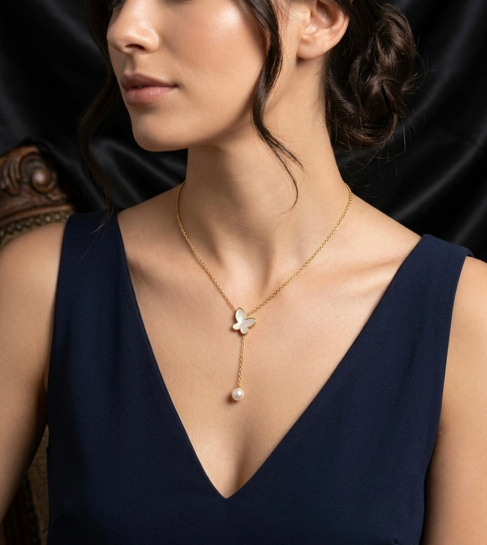 Elegant butterfly pendant with pearl drop