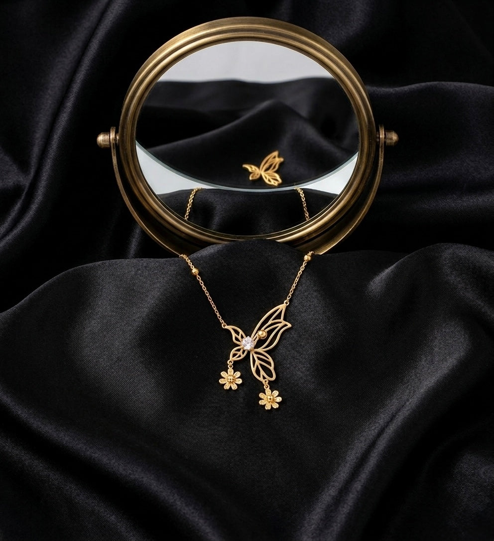 Elegant gold butterfly necklace with flowers