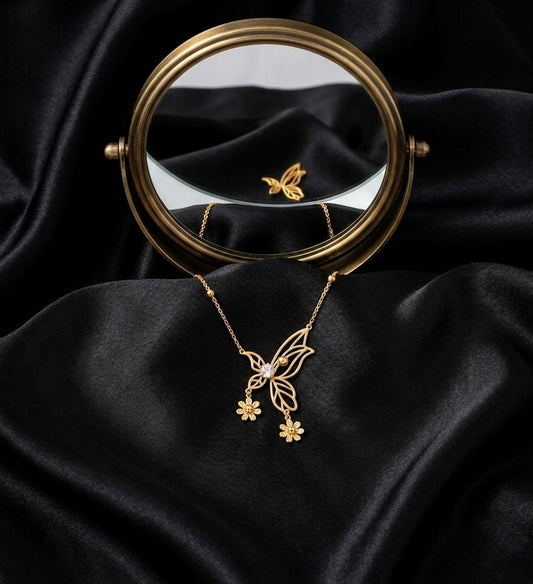 Elegant gold butterfly necklace with flowers