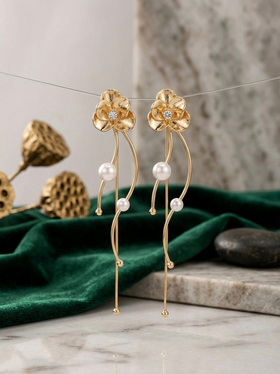 Elegant gold floral drop pearl earrings.