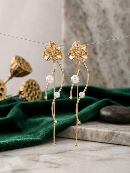 Elegant gold floral drop pearl earrings.